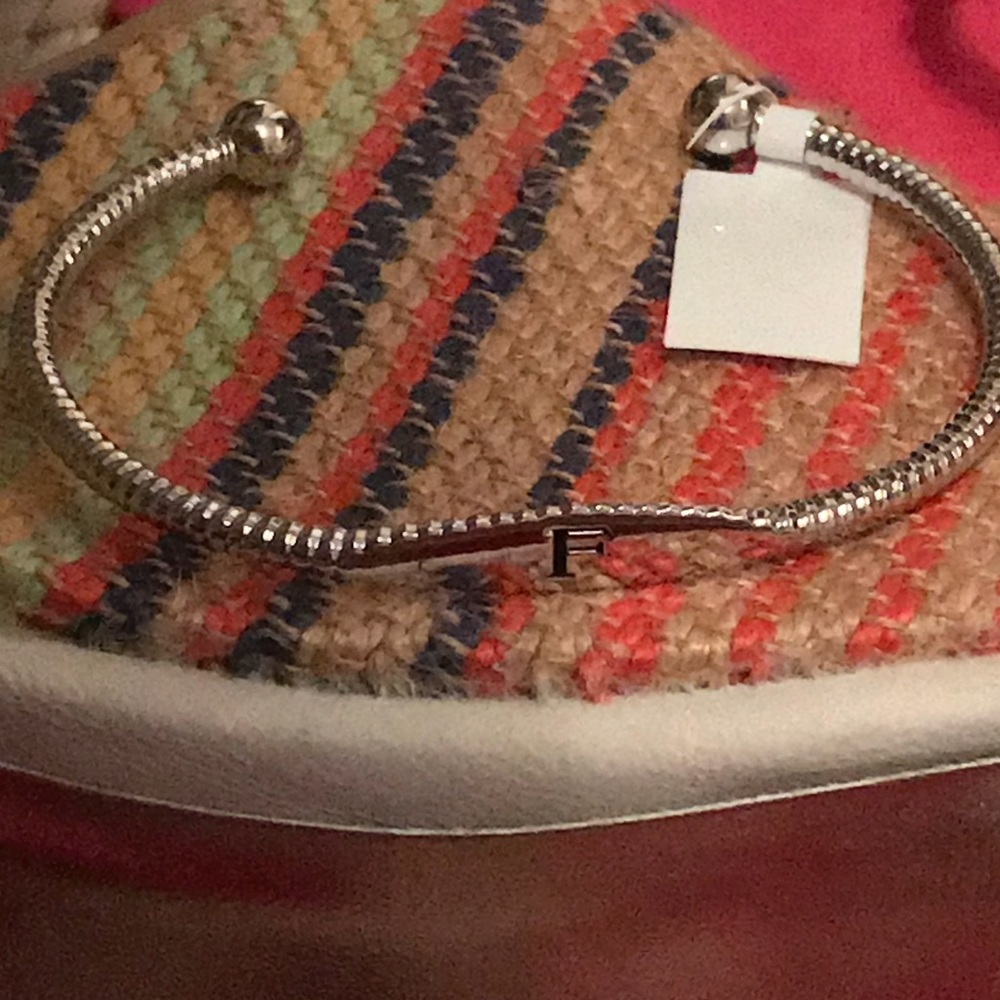 Silver toned bracelet monogrammed “F”